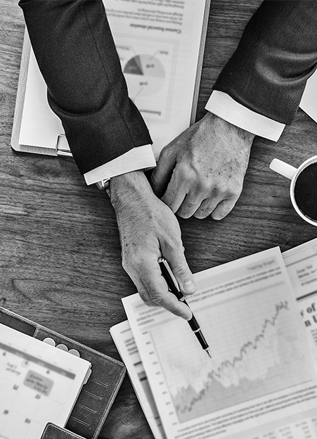 Reviewing financial charts at a desk
